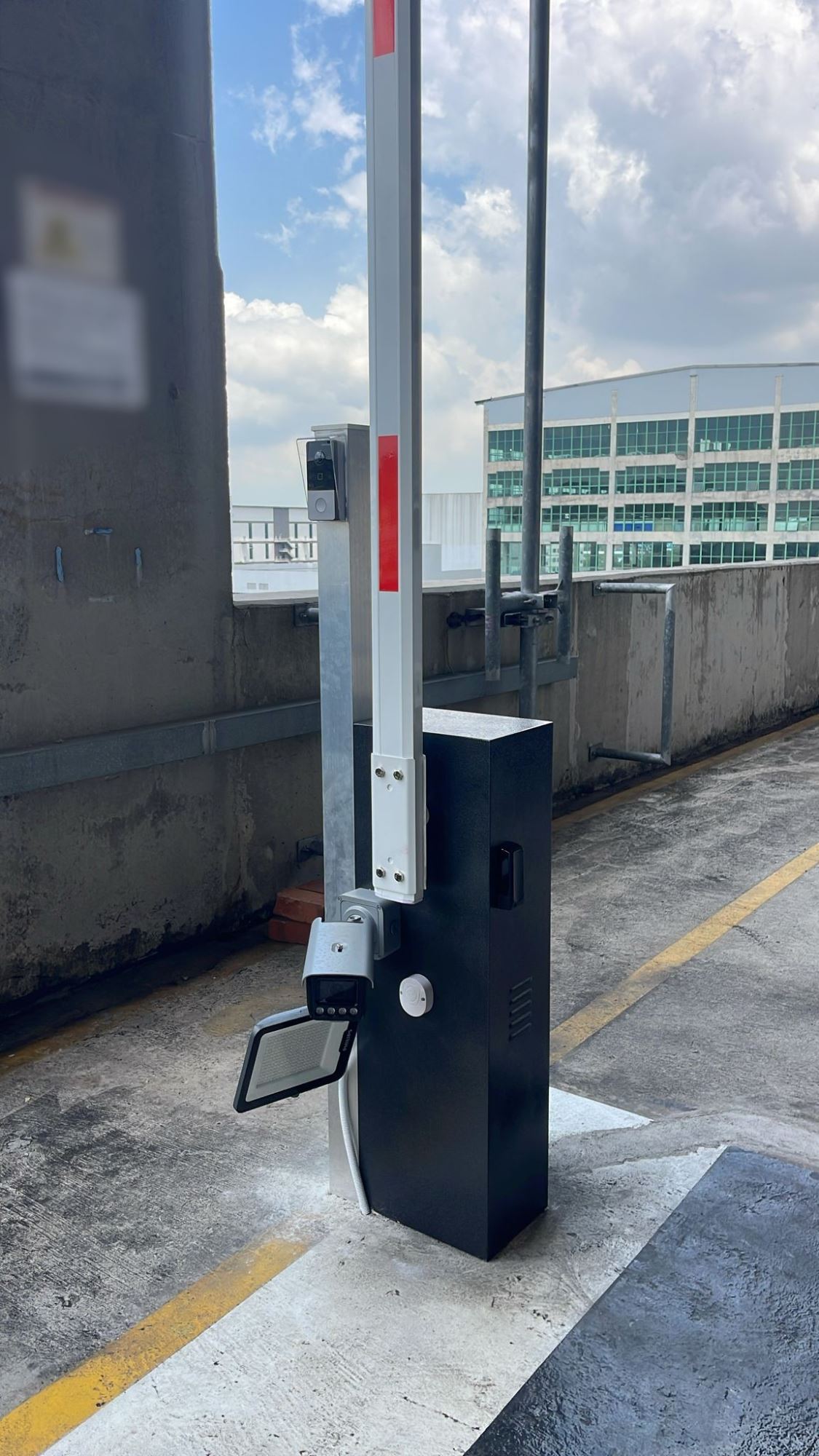Commercial barrier gate with ANPR camera, intercom system and supplementary lighting for license plate recognition