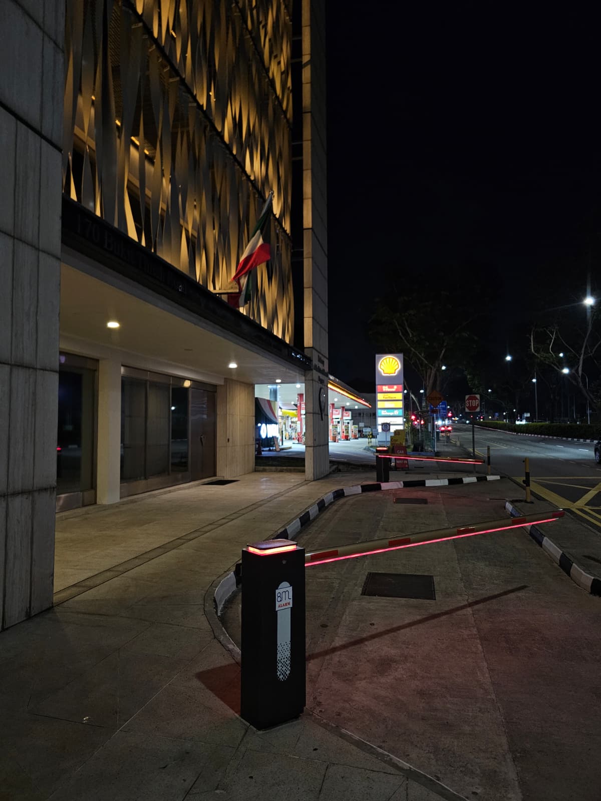 Night view of high-security barrier gate with LED lighting on the barrier arm and top of the barrier housing
